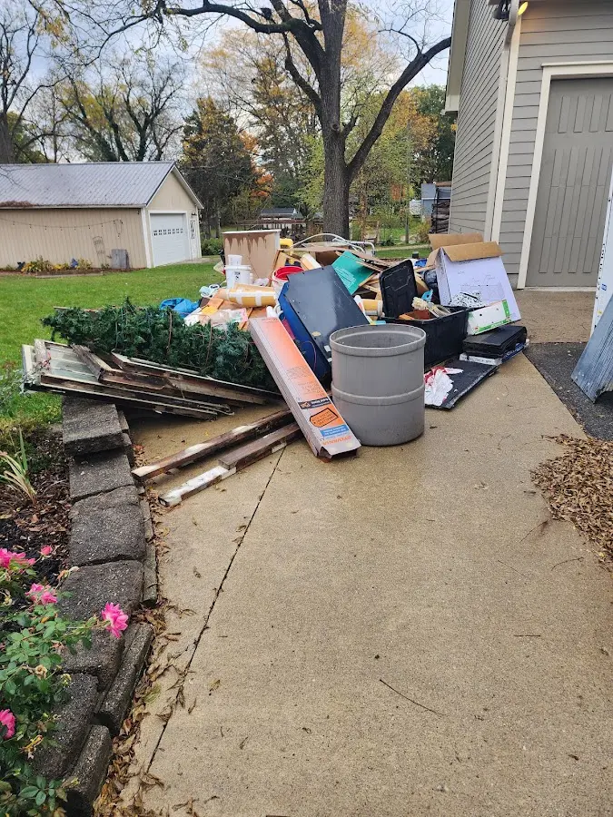 Dumpster being loaded with debris for Commercial Dumpster Rental in Zebulon